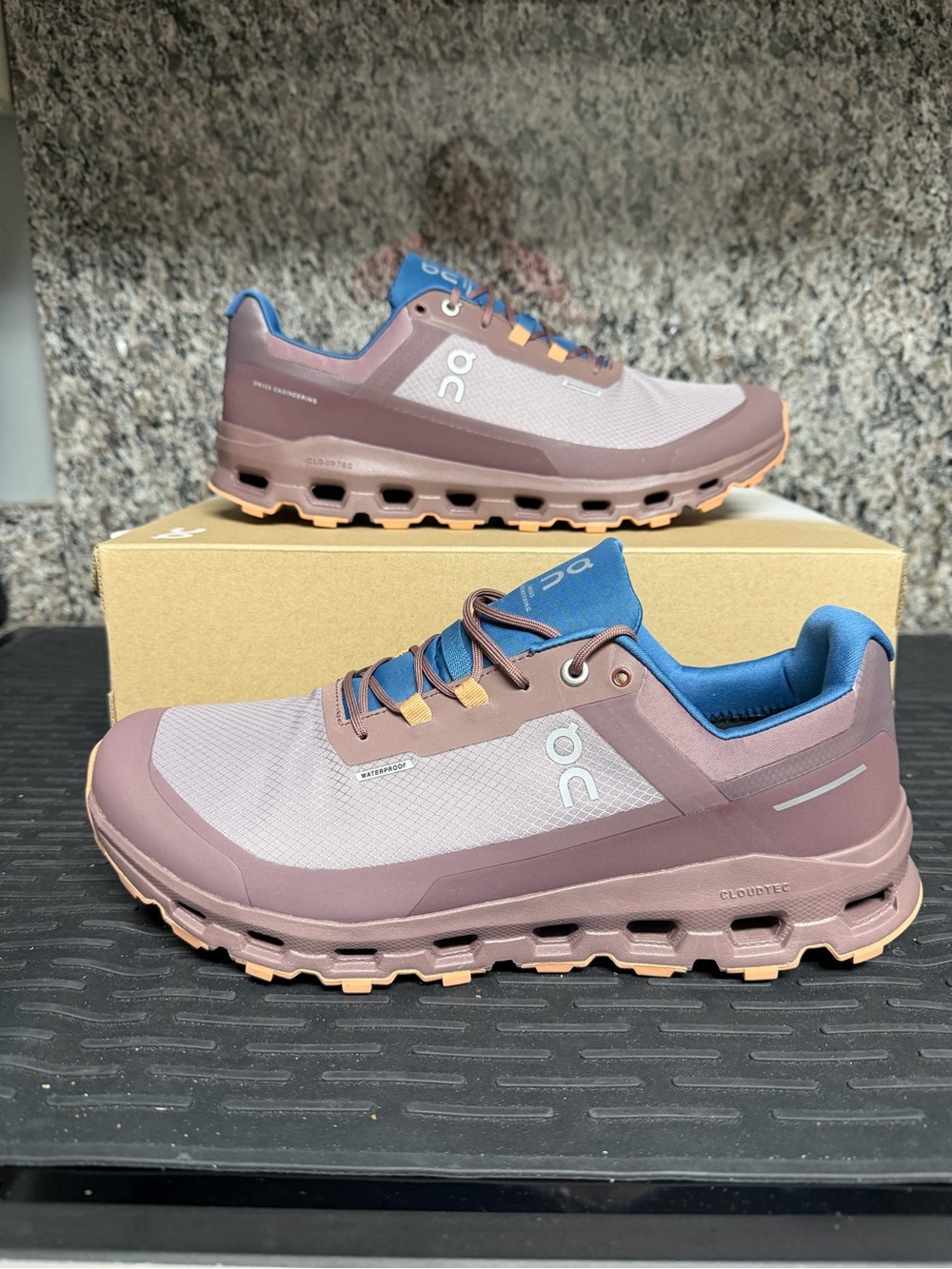 On Running Men's Trail Shoes - Mauve Upper with Blue Liner and Tan Accents